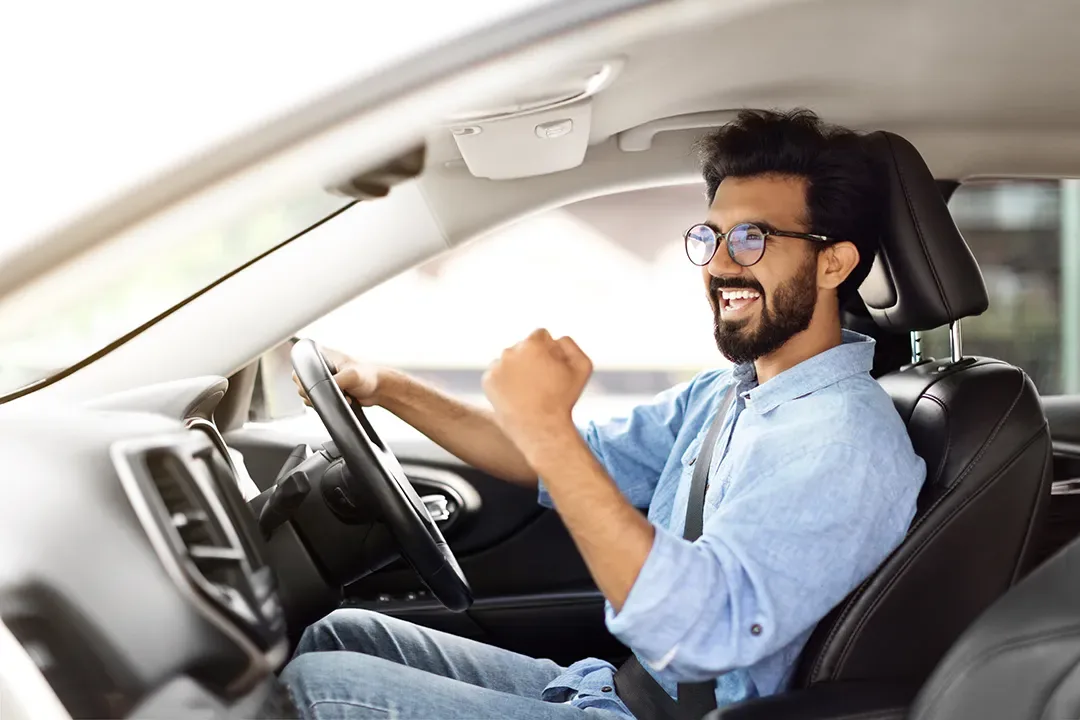 A relaxed driver enjoying a clean car